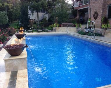 beautiful swimming pool with decorative fountains